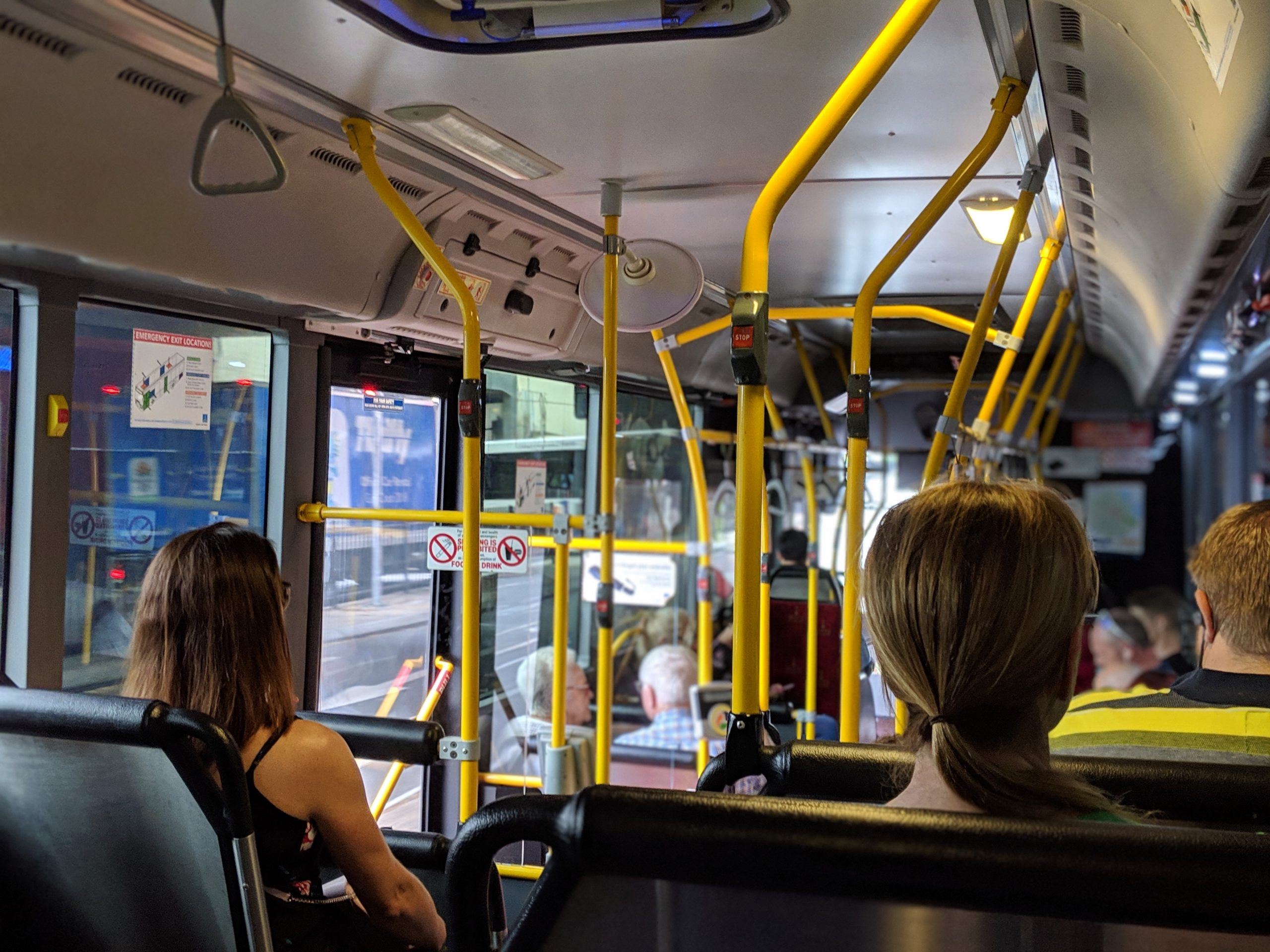 Stock photo of people sitting on a bus. 